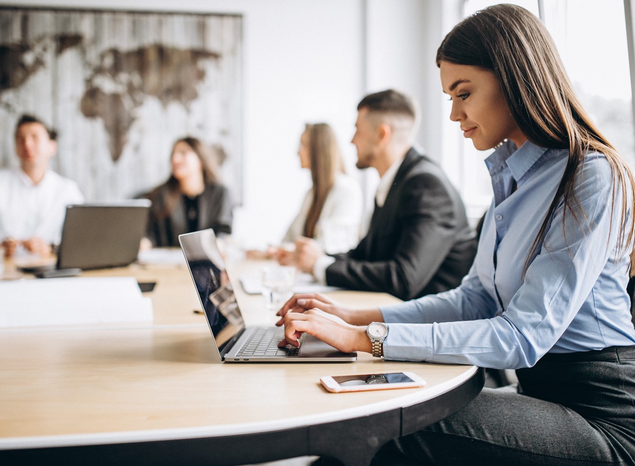 Group Of People Working Out Business Plan In An Office (1)