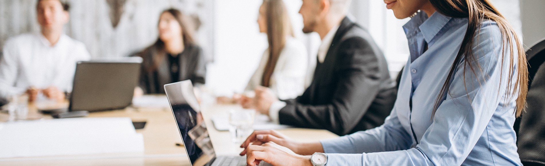 Group Of People Working Out Business Plan In An Office (1)